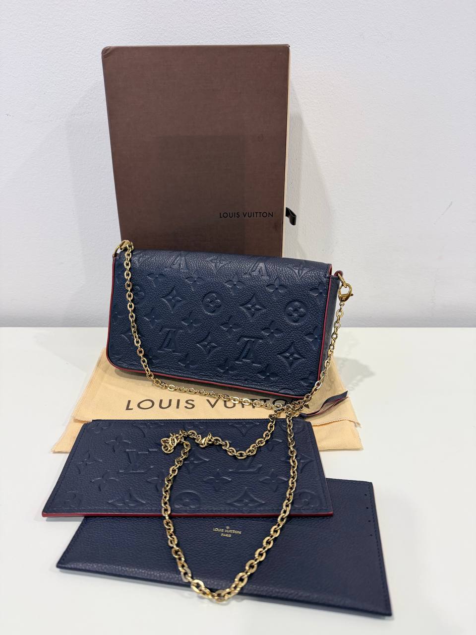 Félicie Pochette – Monogram Empreinte Leather (Navy Blue)