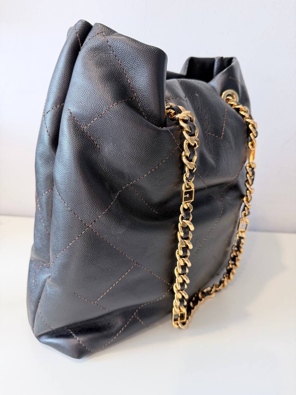 Pre-Loved Black Quilted Bucket Bag with Gold Chain Strap