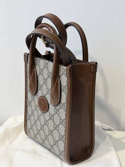 Mini Bolso Tote Gucci Interlocking G en Lona GG Supreme y Piel Marrón